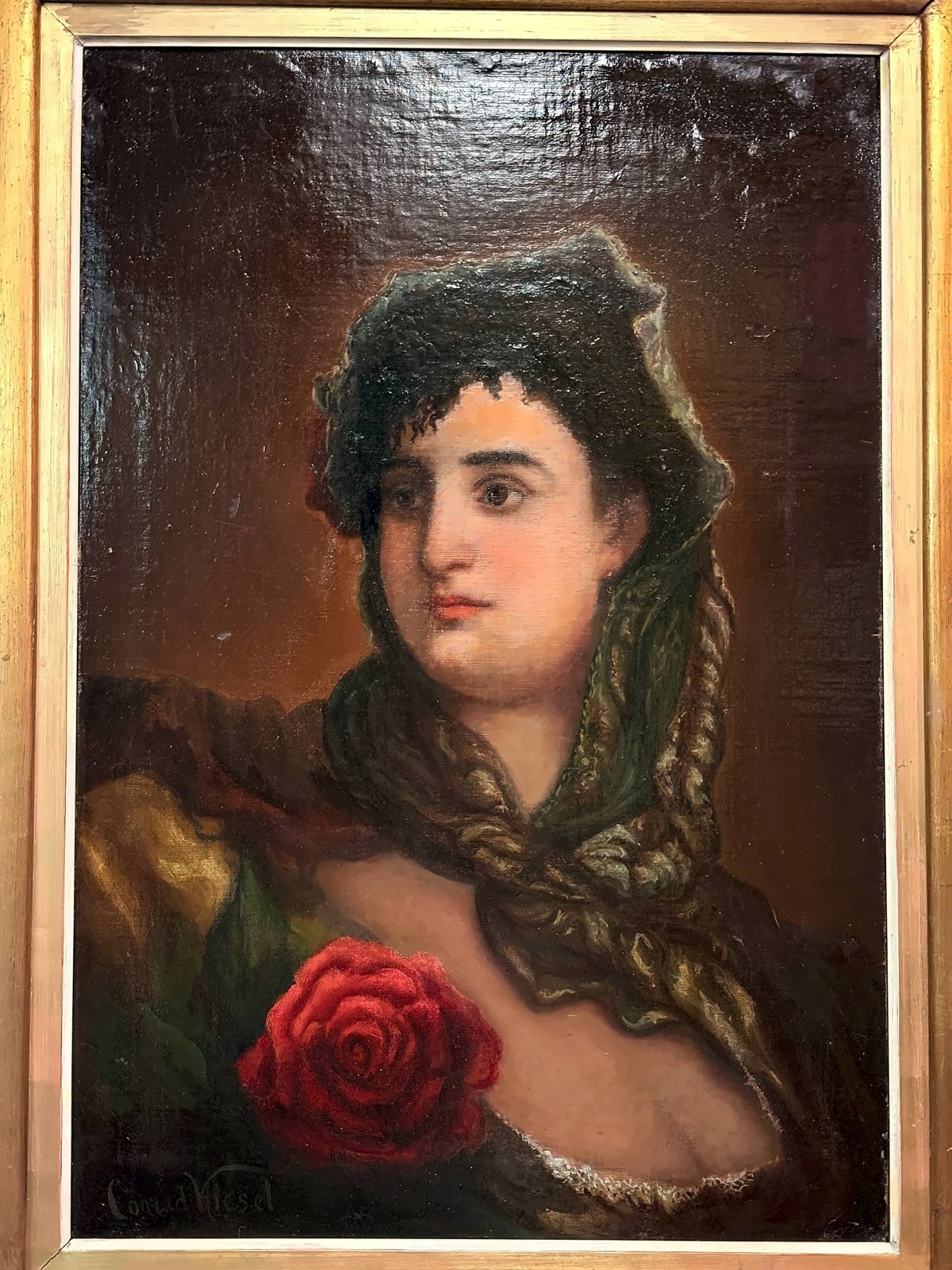 Painting: portrait of a woman with a dark veil and a red rose, in a gilded frame